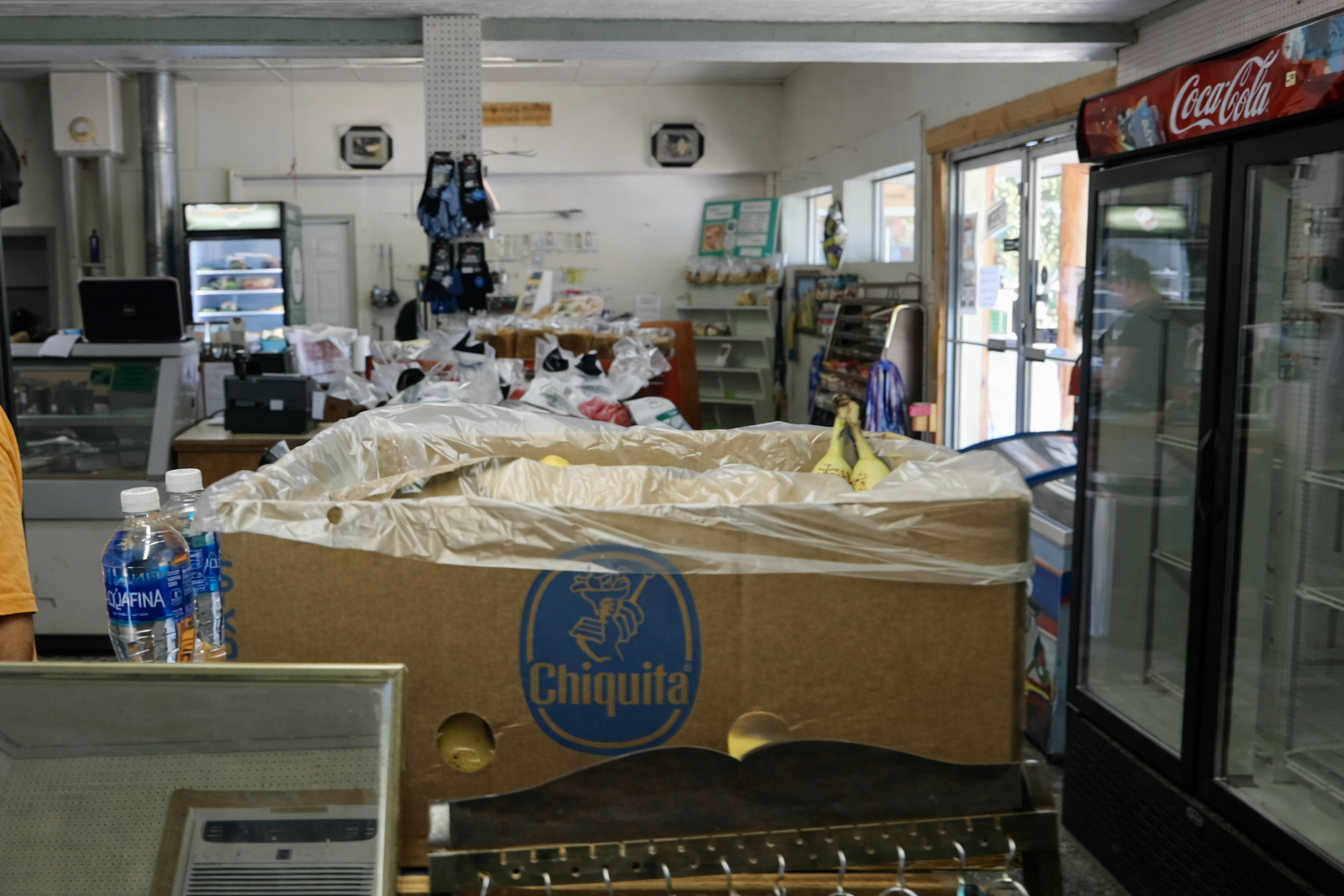 Interior of John Day River Trading Post in Kimberley Oregon, showing a quiet country store with snacks, drinks, and coolers along Highway 19