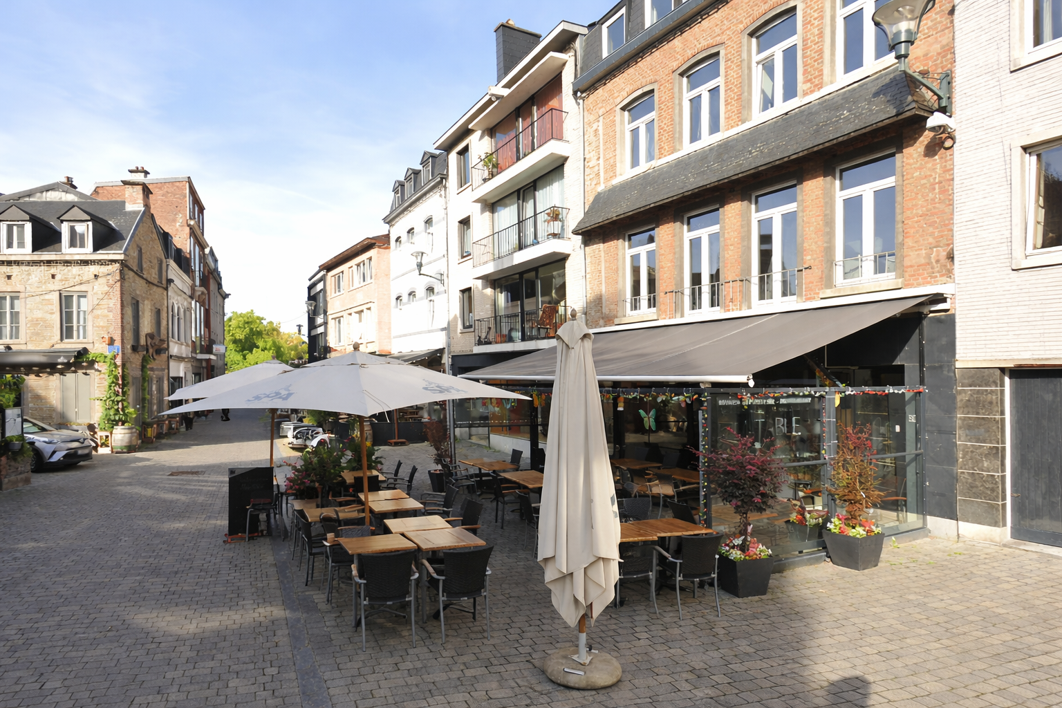 La Table de Spa terrace in Spa Belgium, outdoor seating with umbrellas on Rue Delhasse in the historic city center
