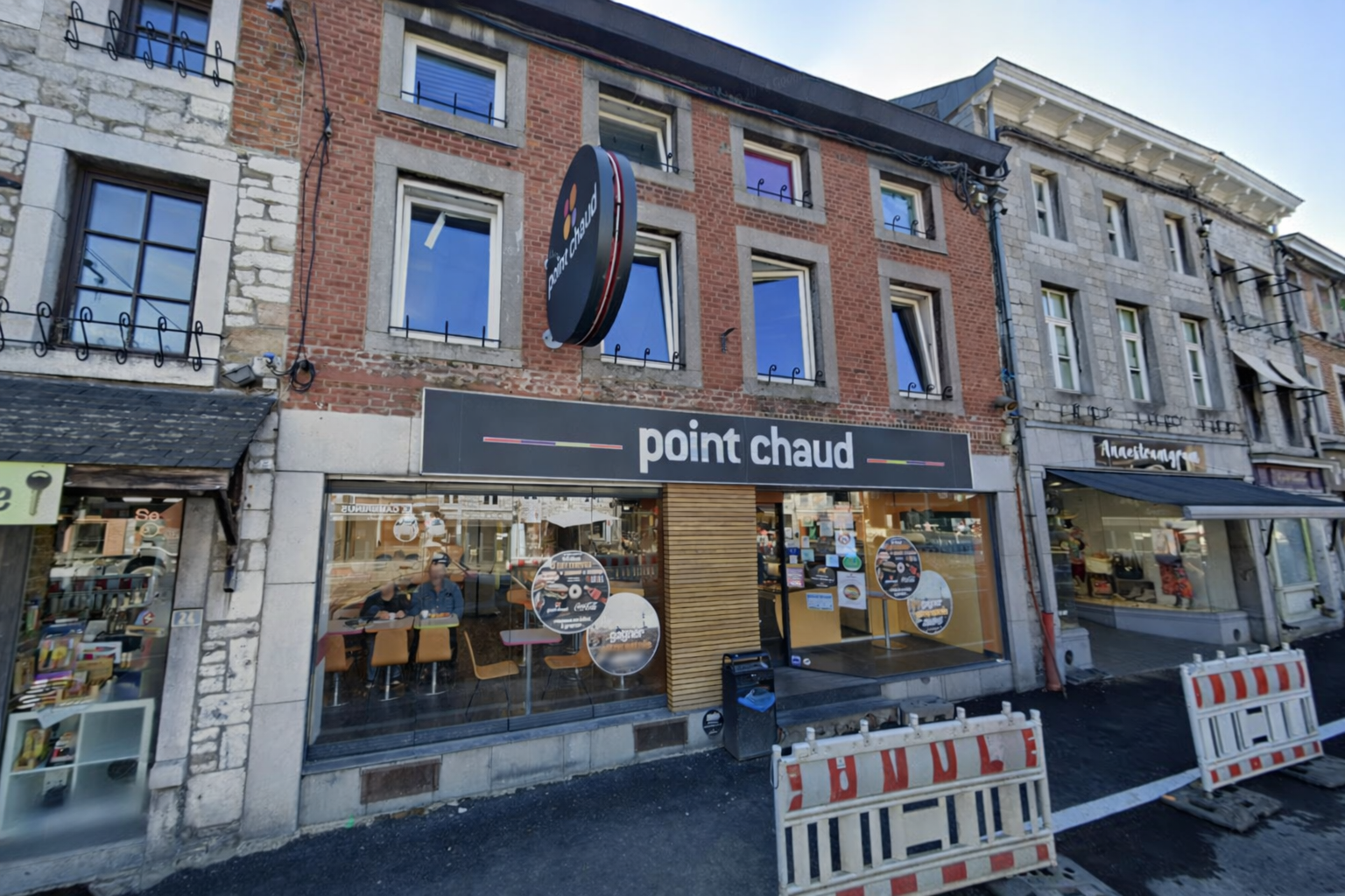 Boulangerie Aywaille centre Point Chaud exterior on a rainy morning, bakery storefront in the center of Aywaille Belgium