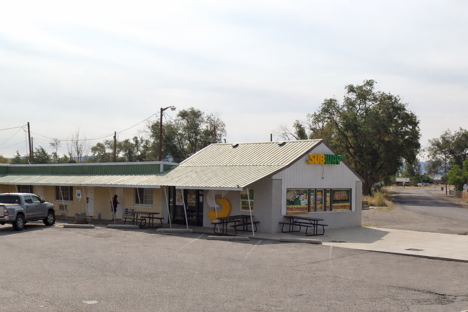 Subway restaurant on US-95 in McDermitt Nevada with outdoor seating along a rural highway