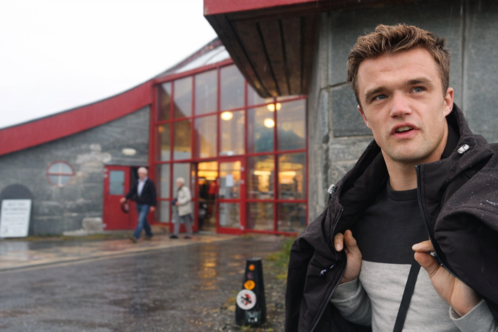 Visitor Peter Smit at the Arctic Circle Centre Norway entrance in Saltfjellet, standing outside the iconic Arctic Circle building along the E6