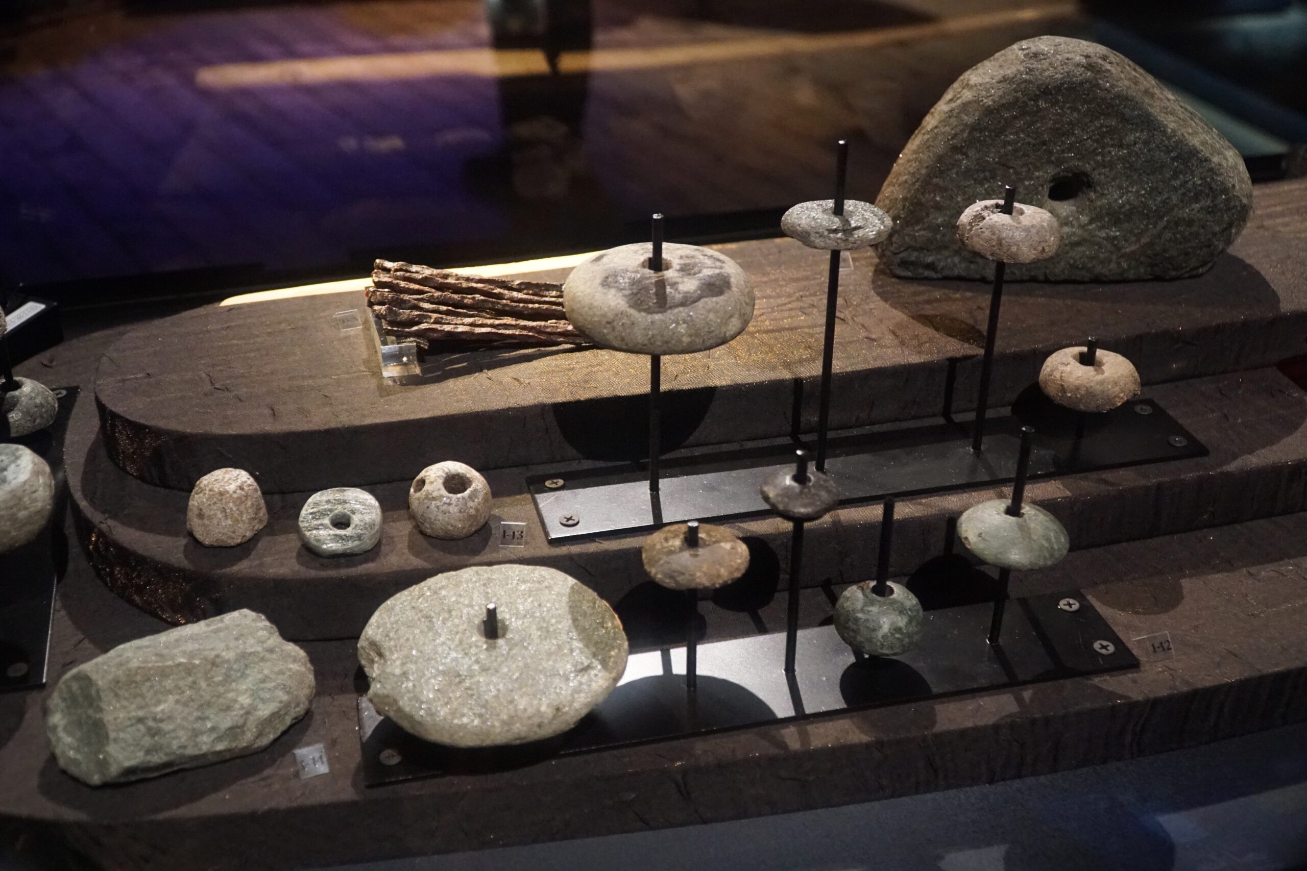 Lofotr Viking Museum interior display with Viking stone tools, fishing weights and everyday objects used by Vikings in the Borg area on the Lofoten Islands