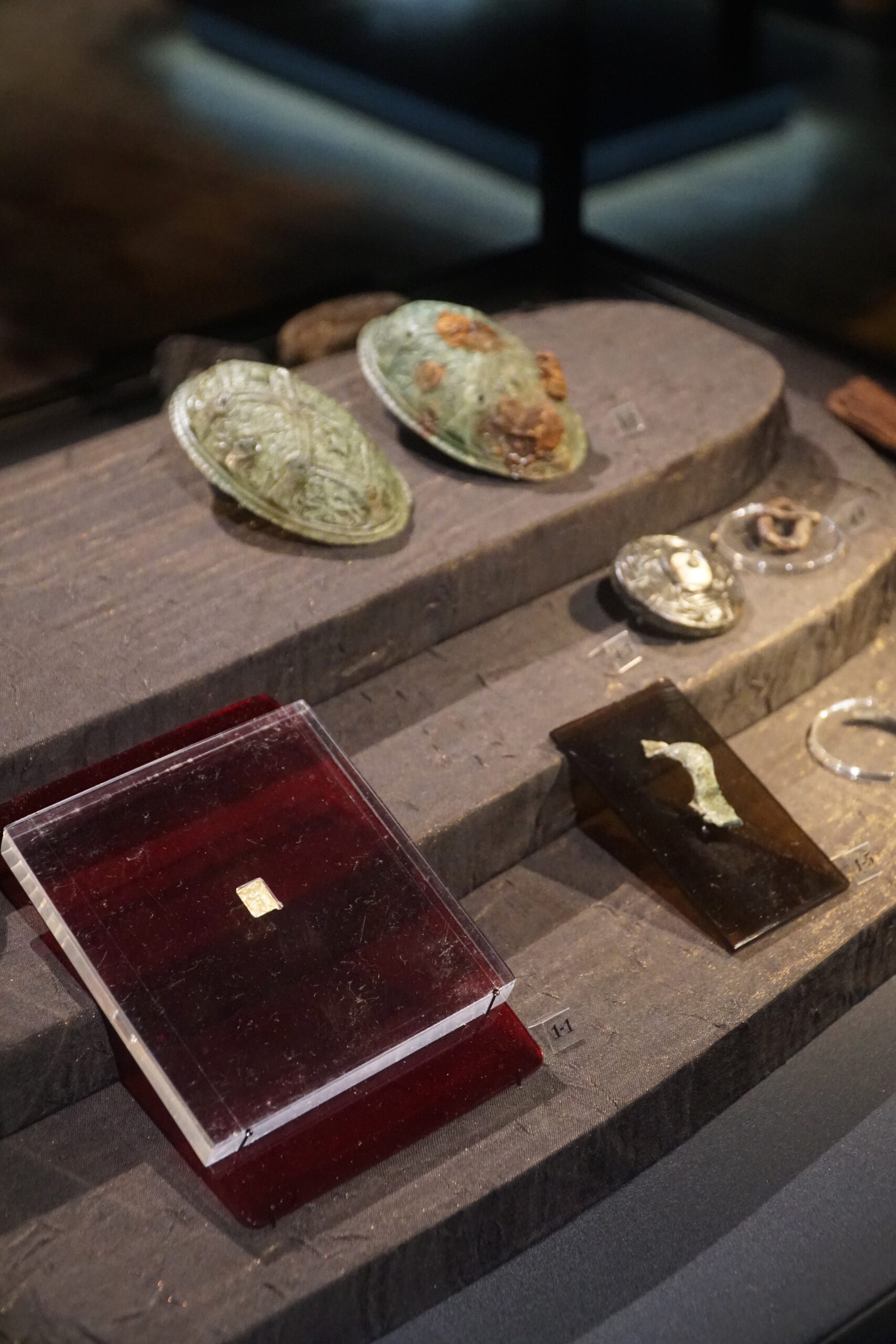 Lofotr Viking Museum interior exhibition showing original Viking artifacts and archaeological finds displayed inside the museum in Borg, Lofoten Islands