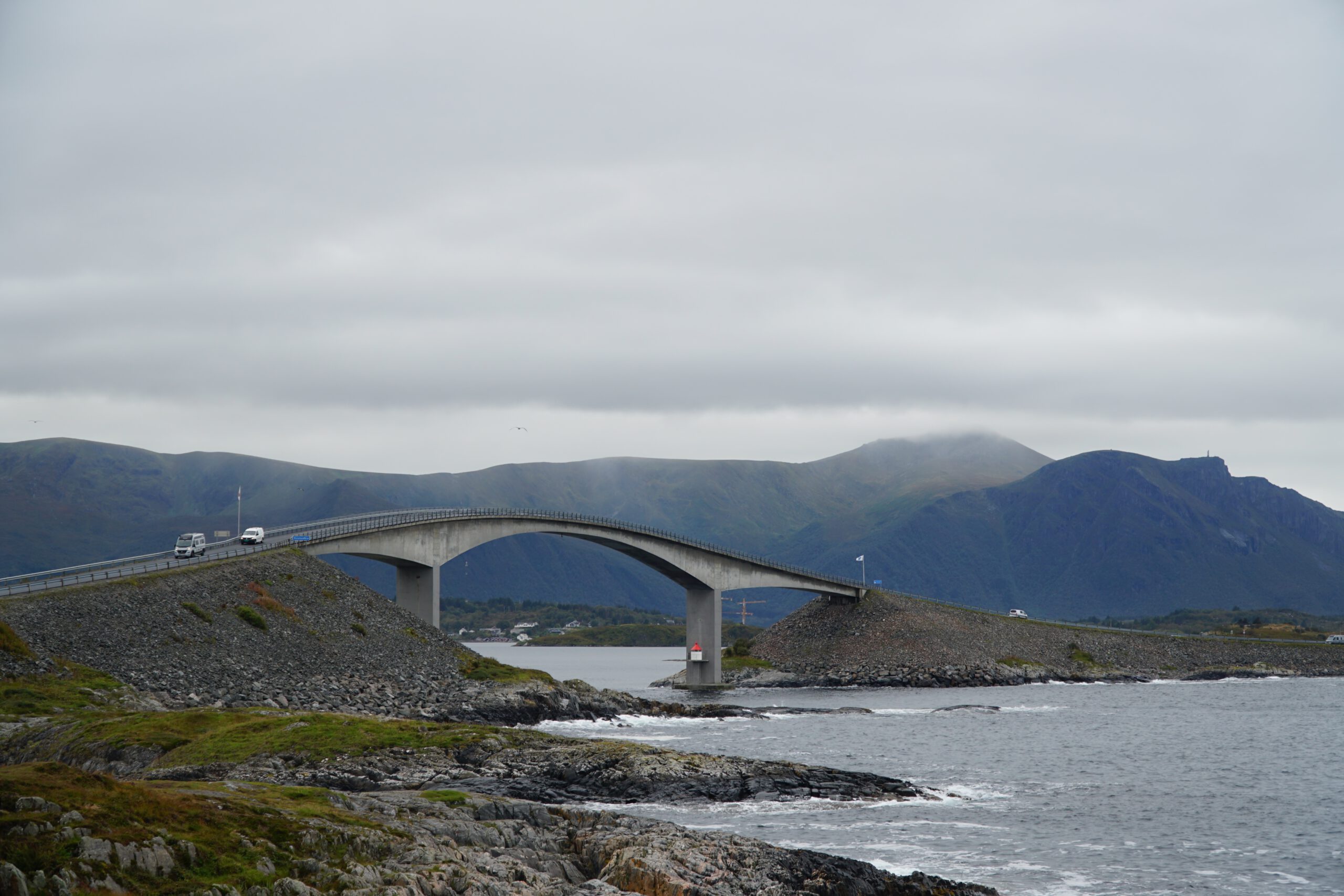 Atlantic Ocean Road Norway Storseisundet Bridge with vehicles crossing over the Atlantic between rocky islands in Møre og Romsdal