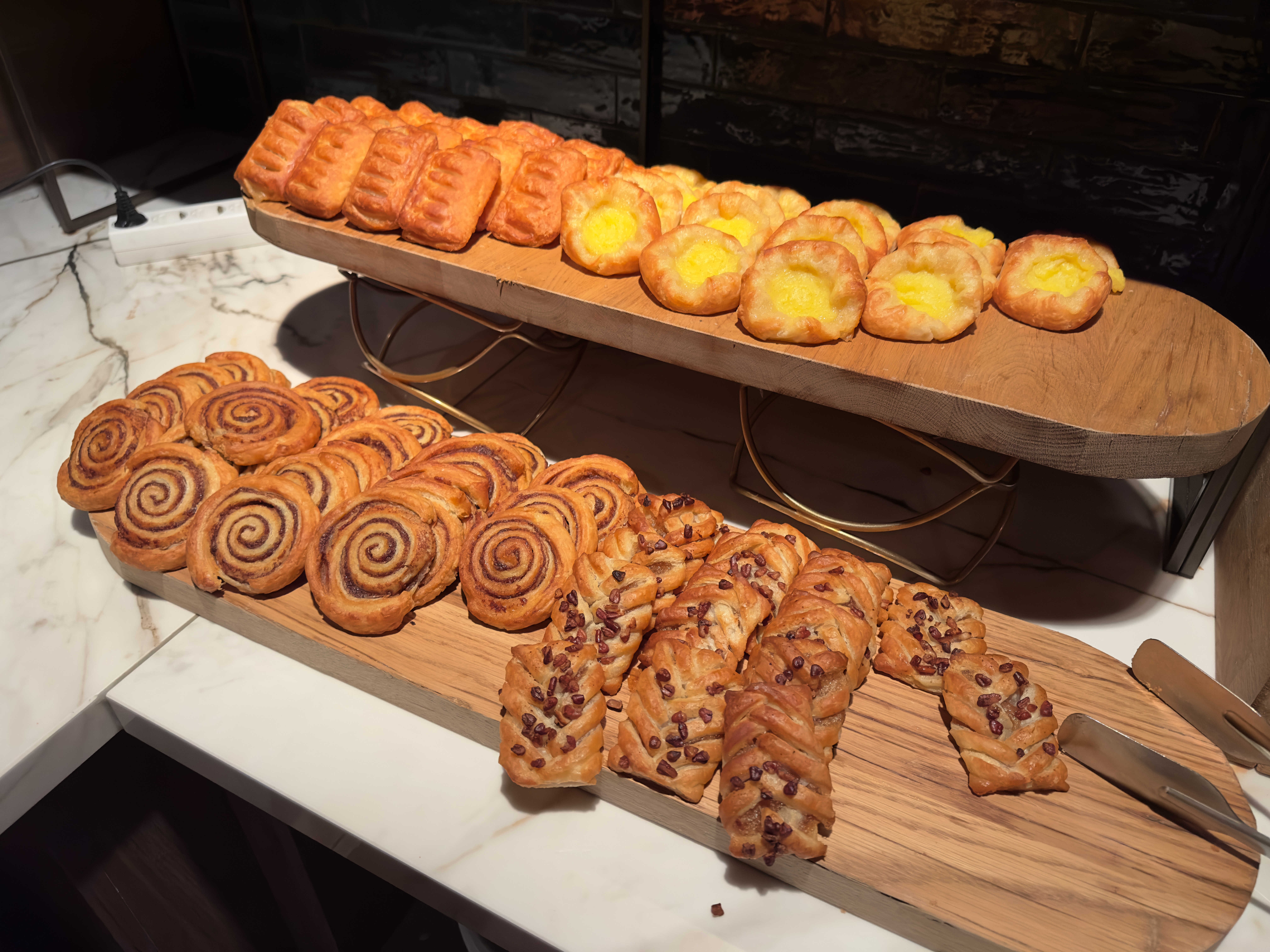 Grand Hotel Ter Duin review – sweet breakfast pastries including cinnamon rolls, chocolate croissants, custard danishes and flaky puff pastries served at the breakfast buffet in Burgh-Haamstede.