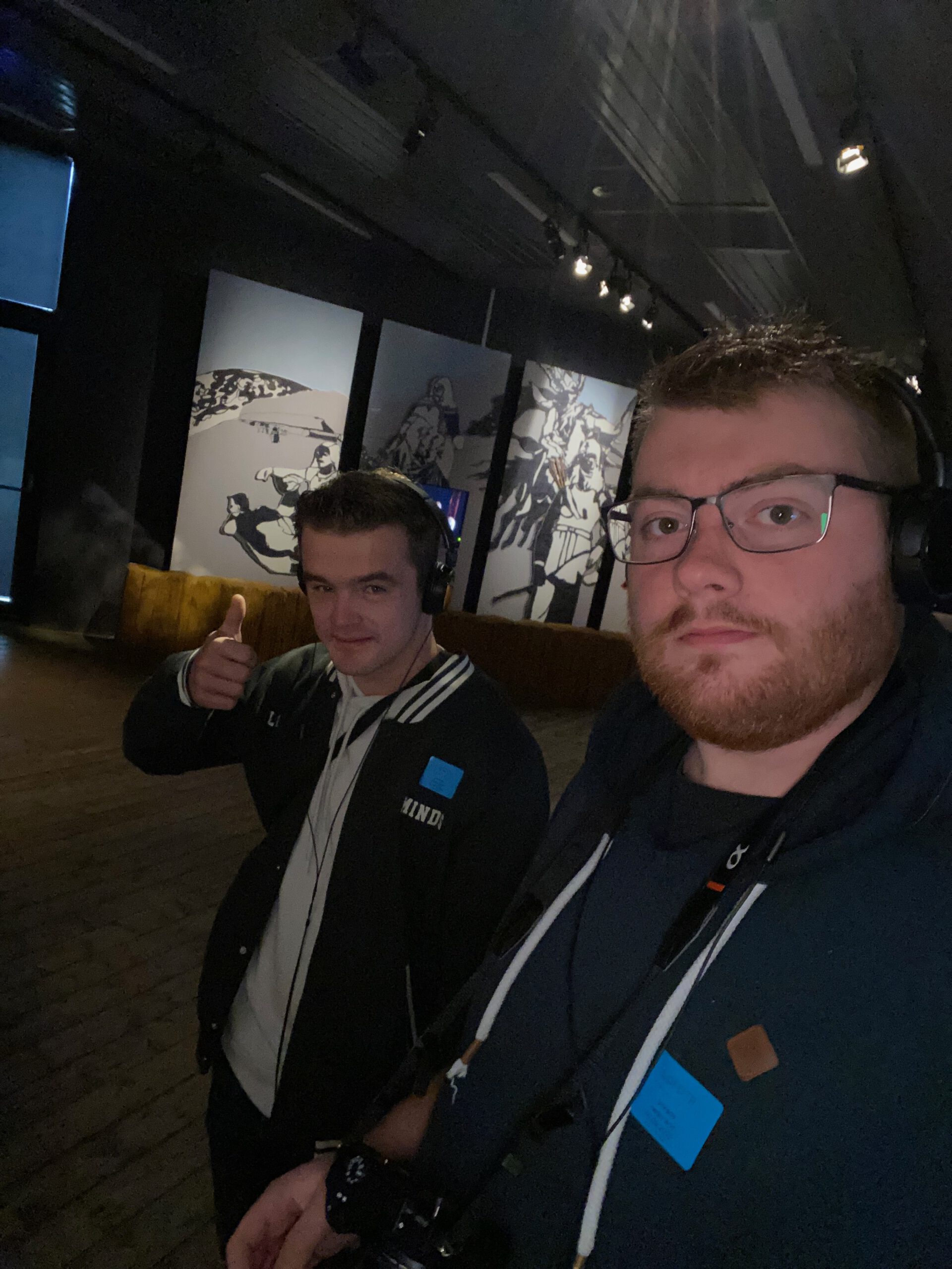 Lofotr Viking Museum interior experience with visitors Timo van den Berg (Timeuw) and Peter Smit exploring the exhibition space and watching Viking storytelling visuals inside the museum