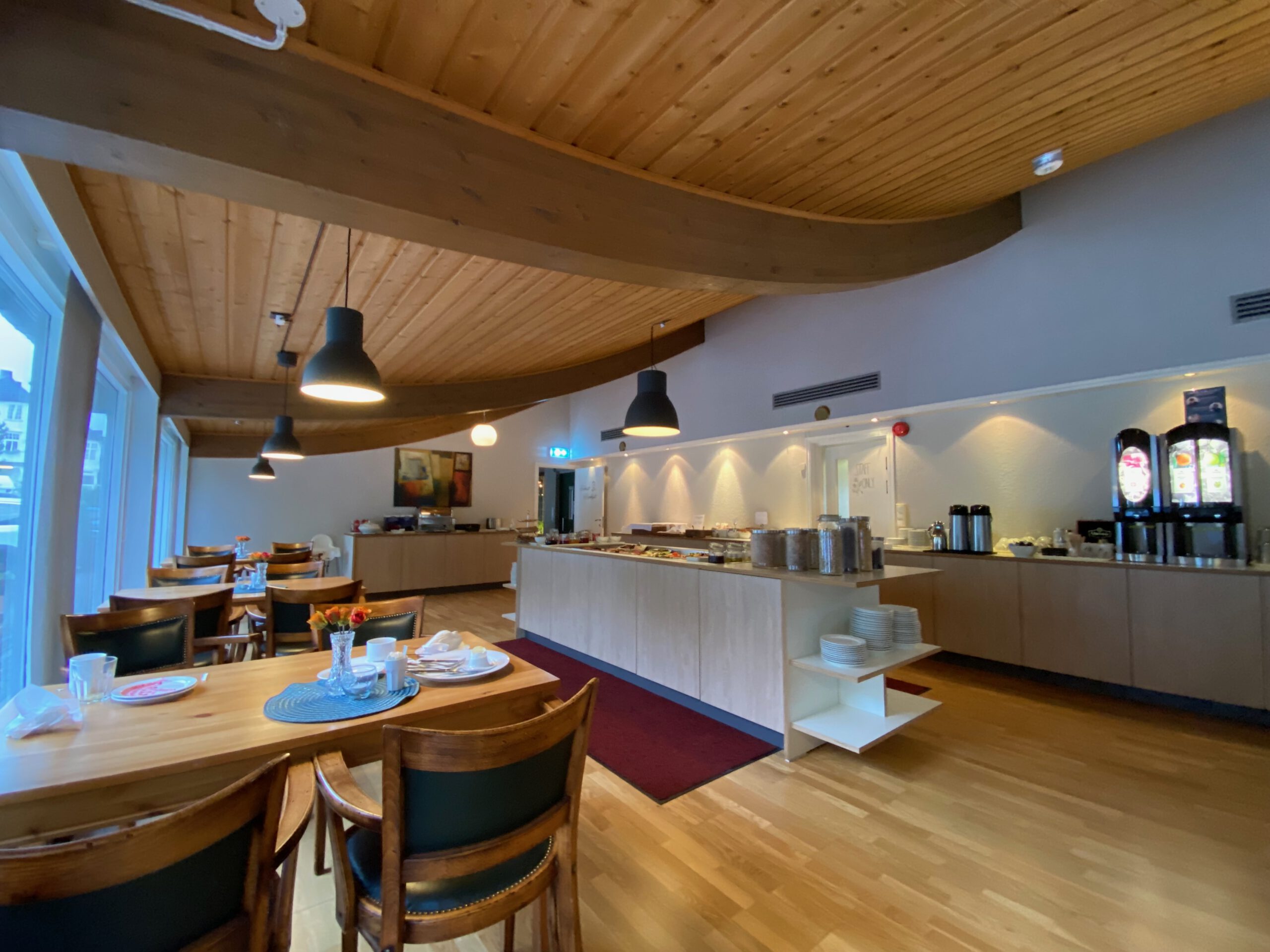 Støren Hotel Norway review breakfast room interior with buffet tables and seating area, highlighting generous morning selection for road trip travelers
