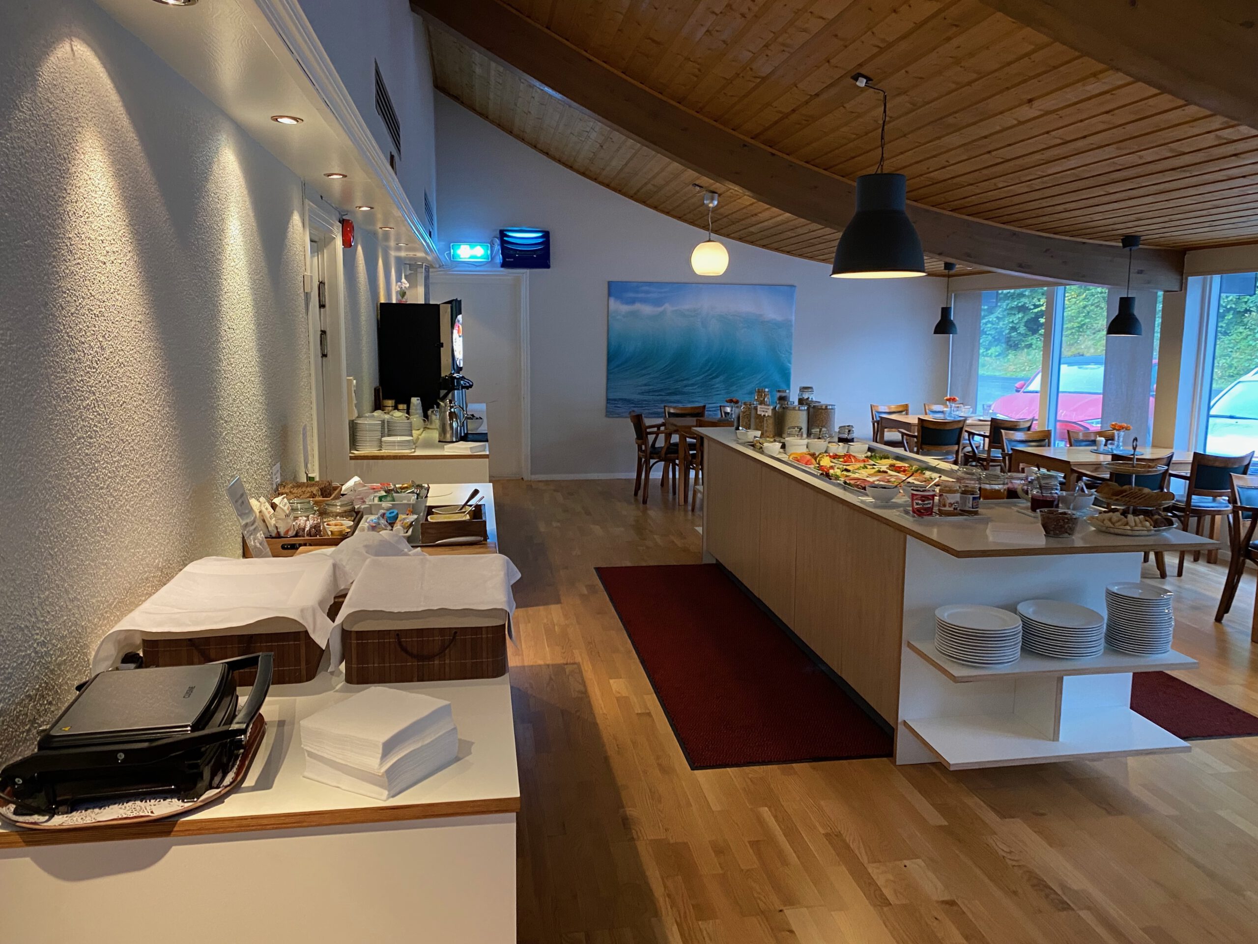 Støren Hotel Norway review breakfast buffet area in Trøndelag, showing bread station, fruit selection, coffee corner and spacious dining layout