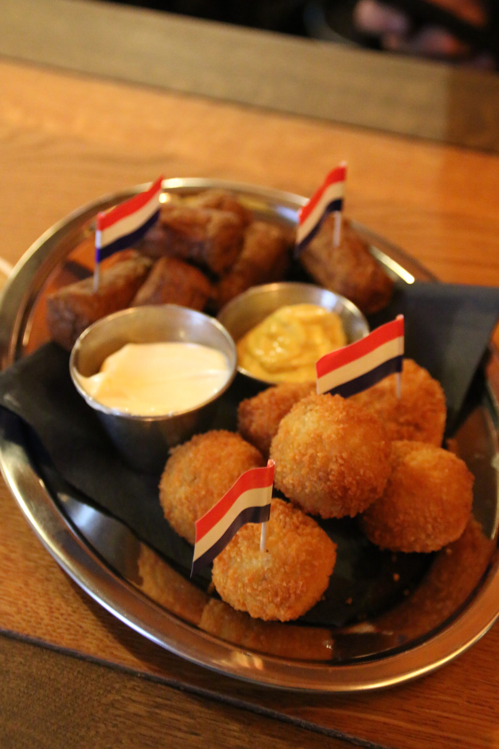 Café Rembrandt Schiphol snack plate with Dutch bitterballen, croquettes, and classic dipping sauces served at Schiphol Amsterdam Airport