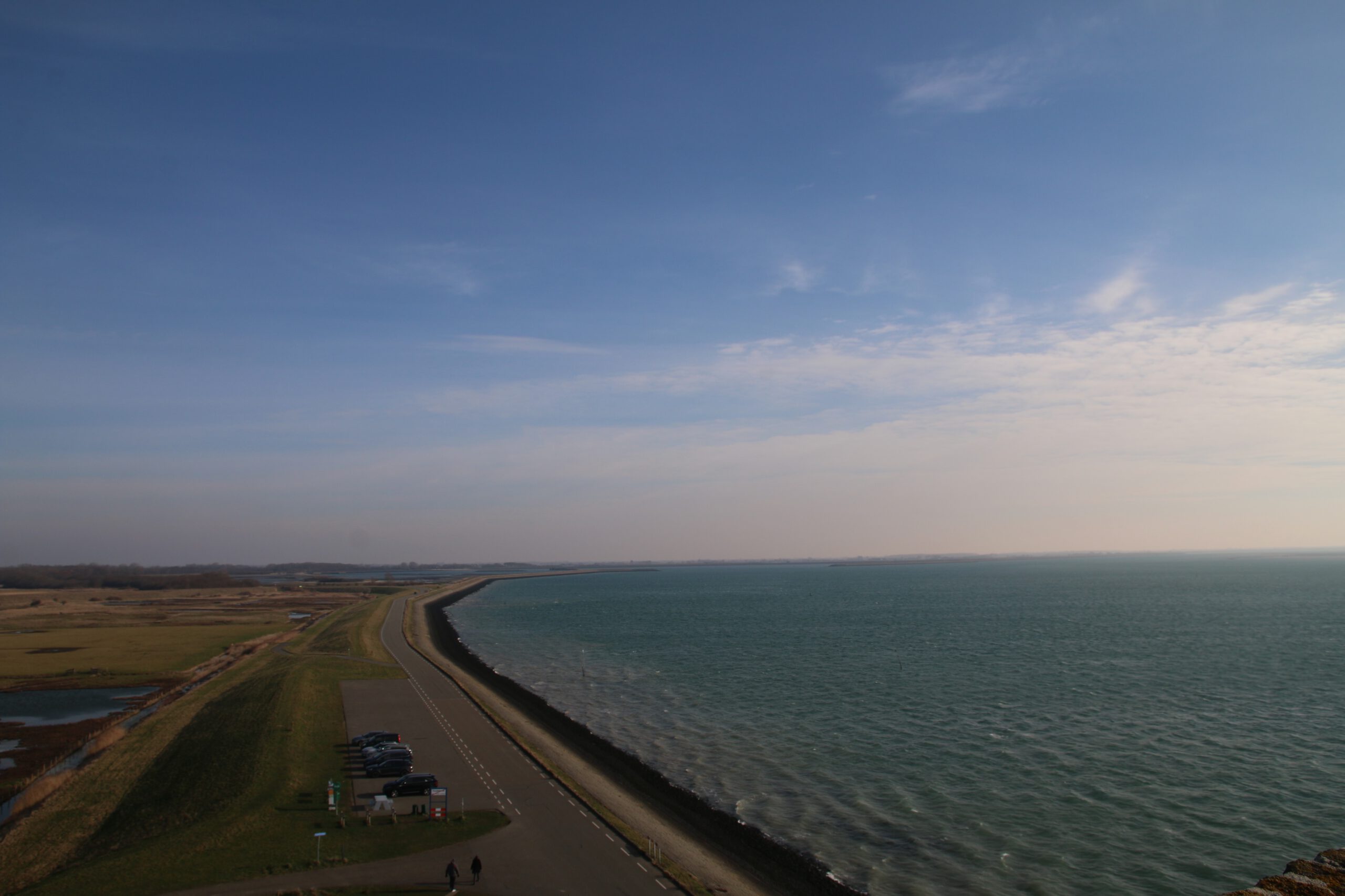 Plompe Toren Koudekerke view over the Oosterschelde with coastal dike, parking area and wide open Zeeland horizon