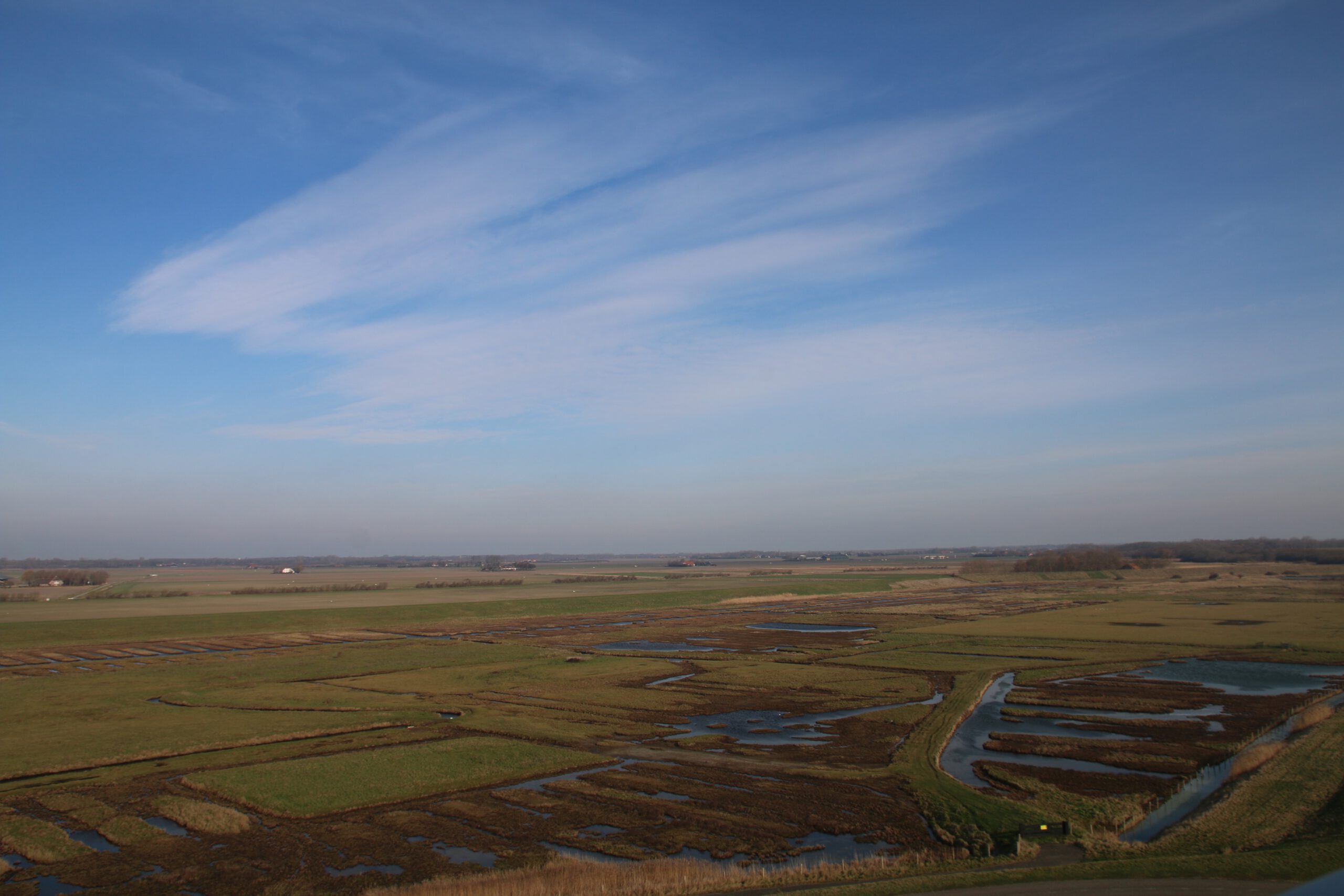 Plompe Toren Koudekerke view over the Koudekersche Inlaag with tidal creeks, salt marsh fields and open Zeeland landscape