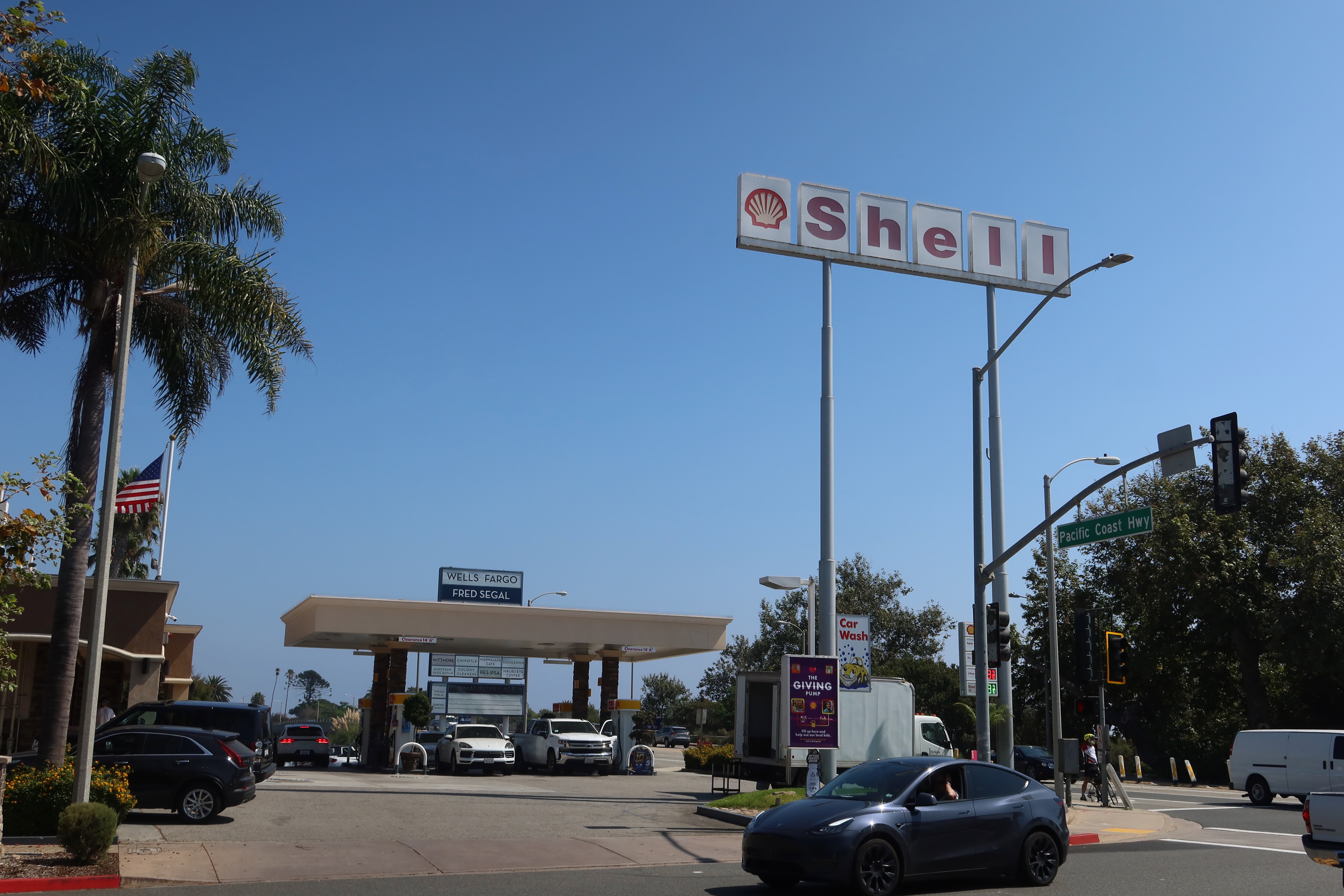 Gas stations in America, Shell Malibu Country Mart on Pacific Coast Highway with roadside traffic and classic California fuel stop atmosphere