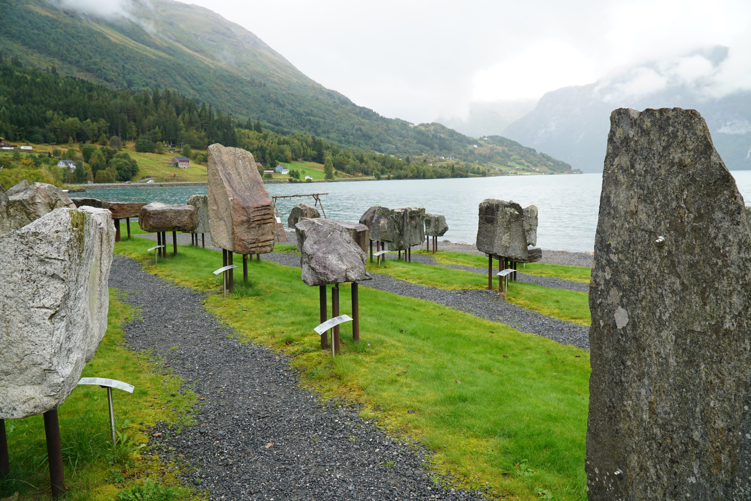 Jostedalsbreen National Park Center outdoor rock exhibition with glacier shaped landscape and lake views in Oppstryn