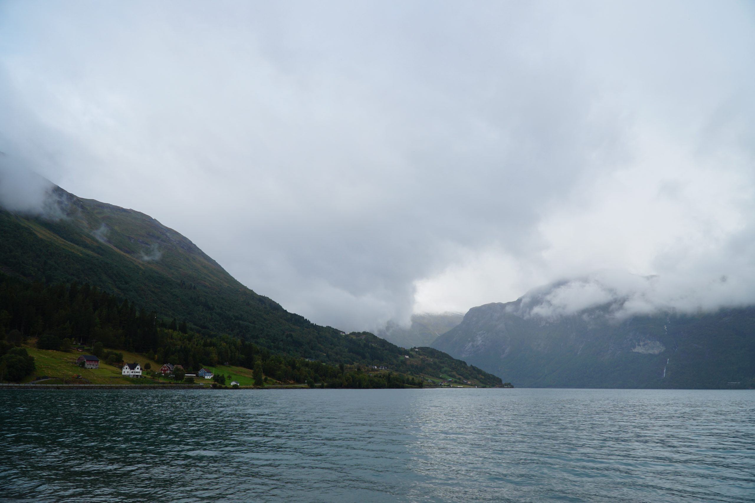Jostedalsbreen National Park Center view over Oppstrynsvatnet with misty mountains and dramatic Norwegian fjord landscape