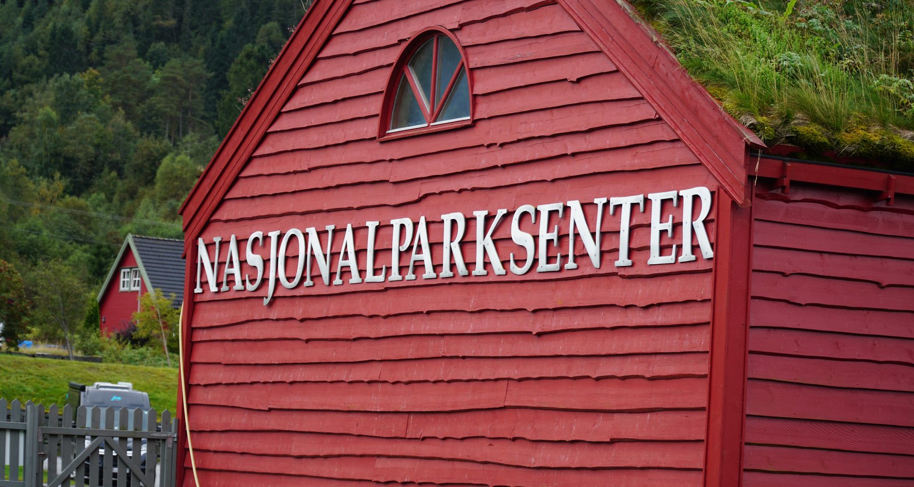 Jostedalsbreen National Park Center red wooden building with traditional grass roof in Oppstryn Norway