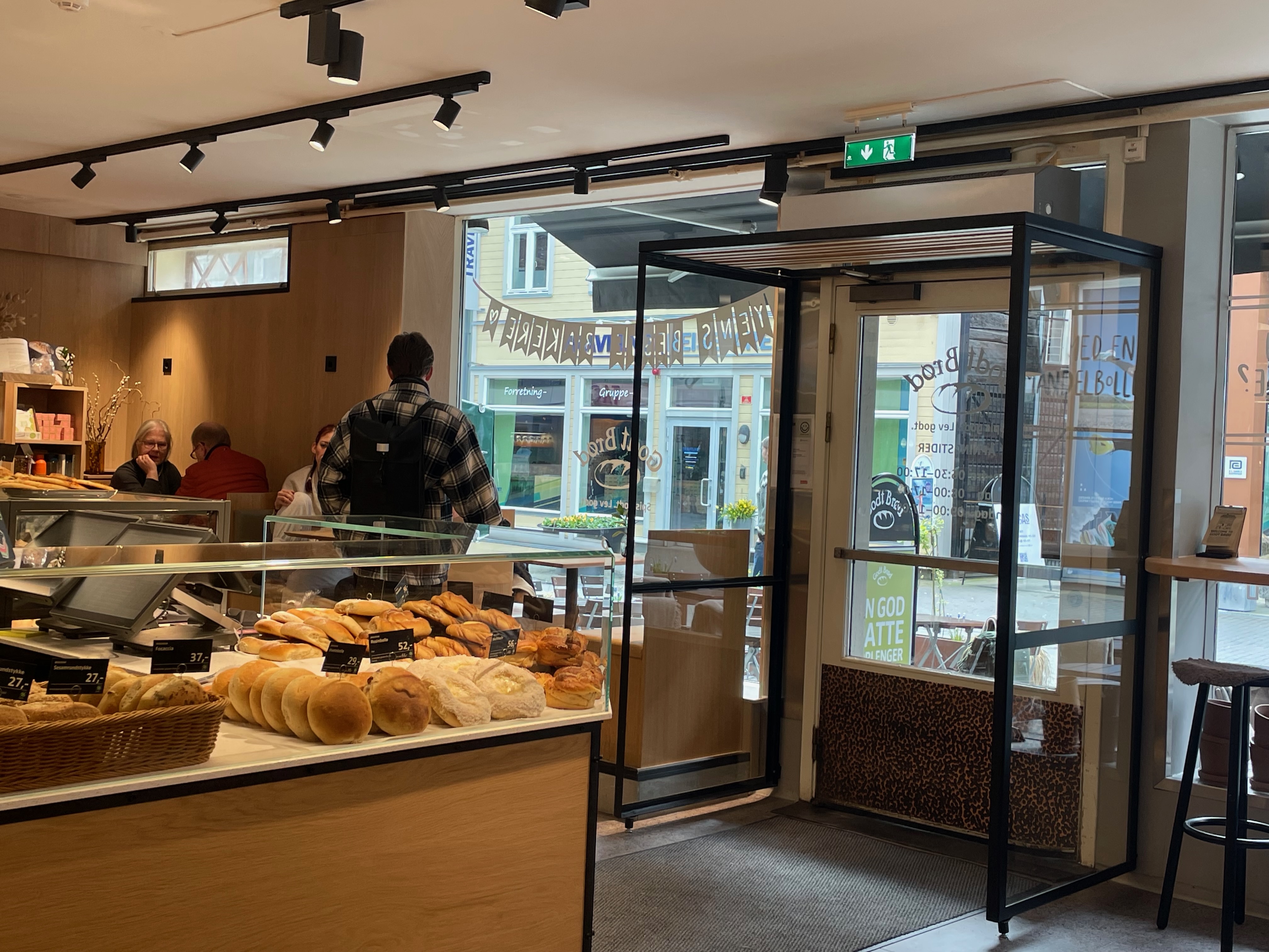 Godt Brød Trondheim bakery display with fresh rolls, pastries and cafe seating inside the Thomas Angells gate location