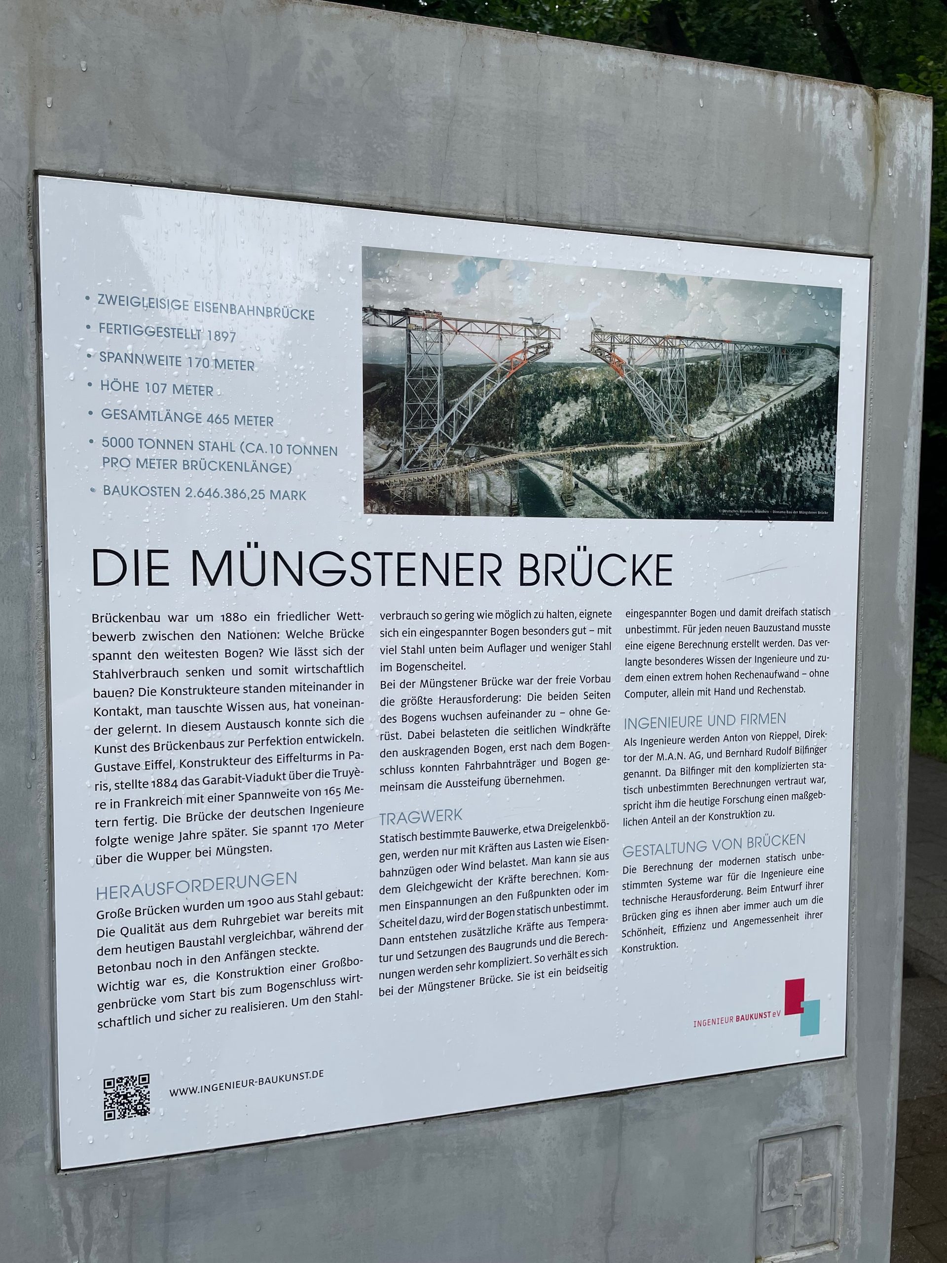 Müngstener Brücke information sign in Brückenpark Müngsten, showing historical facts about Germany’s highest railway bridge in Solingen.