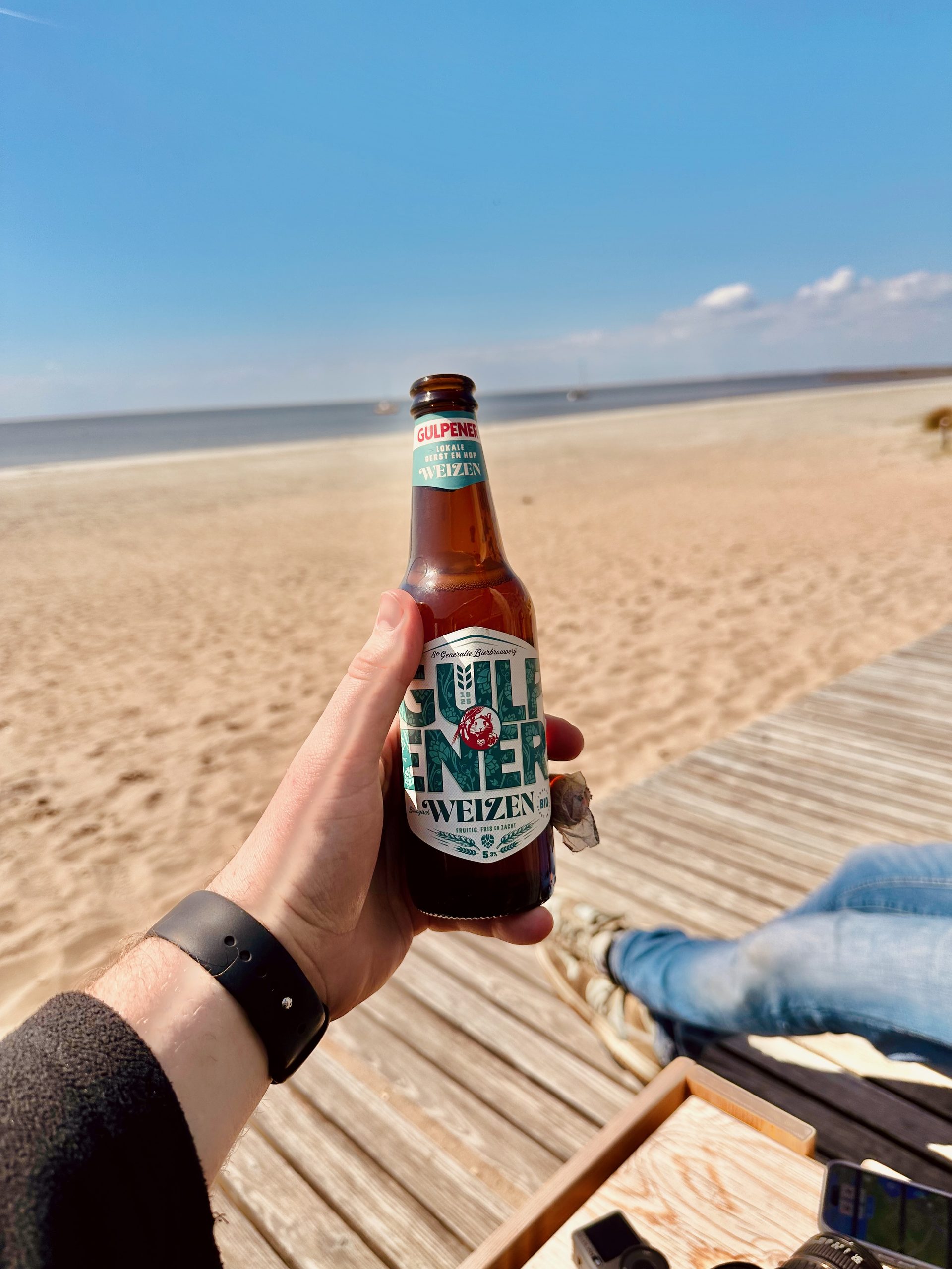 Marker Wadden island visit with a Gulpener Korenwolf Weizen beer on the sunny beach terrace by the water