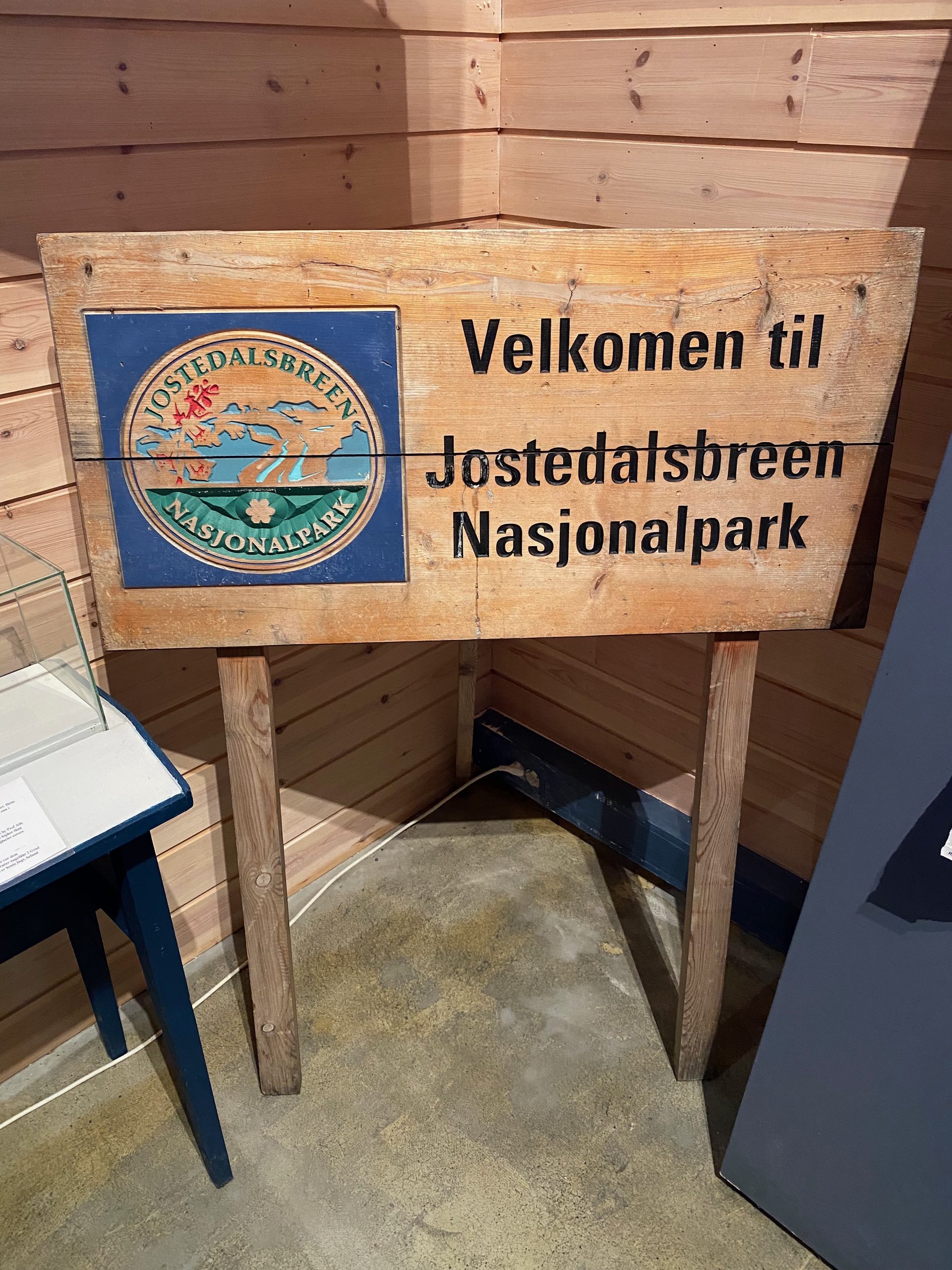 Jostedalsbreen National Park Center wooden welcome sign inside the visitor exhibition for Jostedalsbreen National Park
