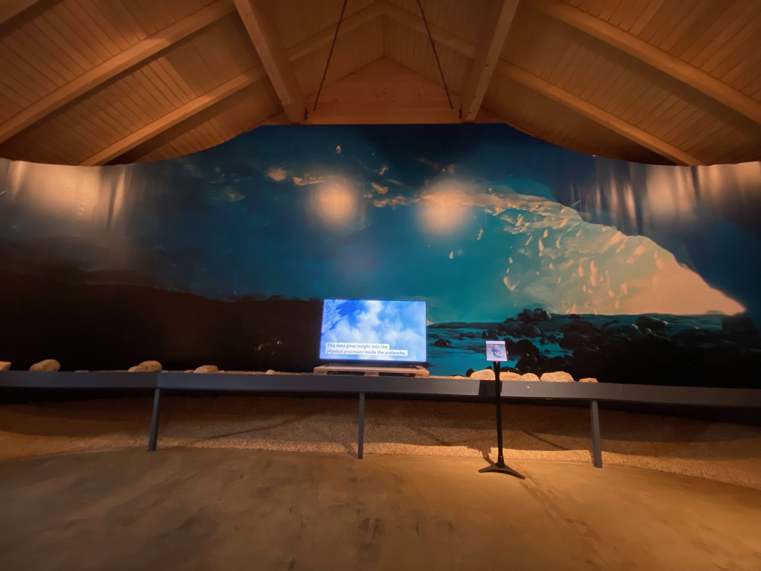 Jostedalsbreen National Park Center avalanche exhibition with glacier landscape display and educational screen in Oppstryn Norway