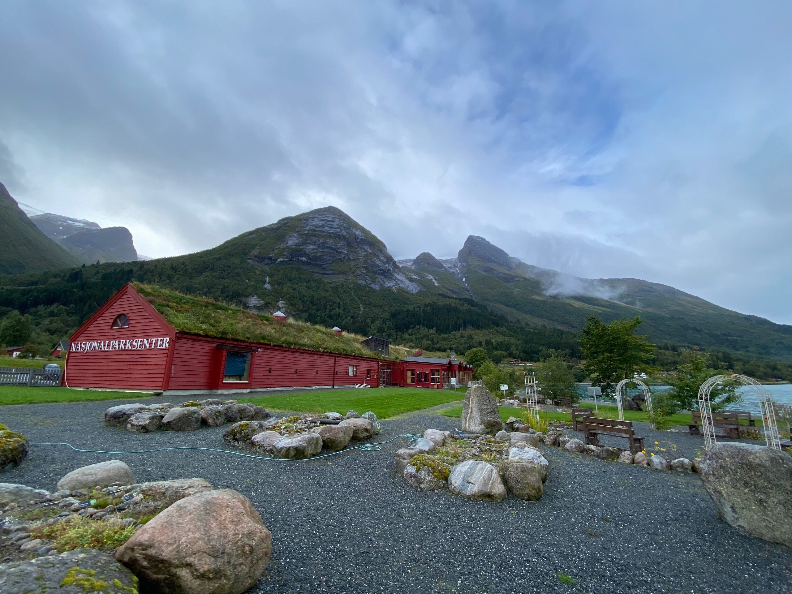 Jostedalsbreen National Park Center in Oppstryn surrounded by mountains, gardens and Norwegian glacier landscape