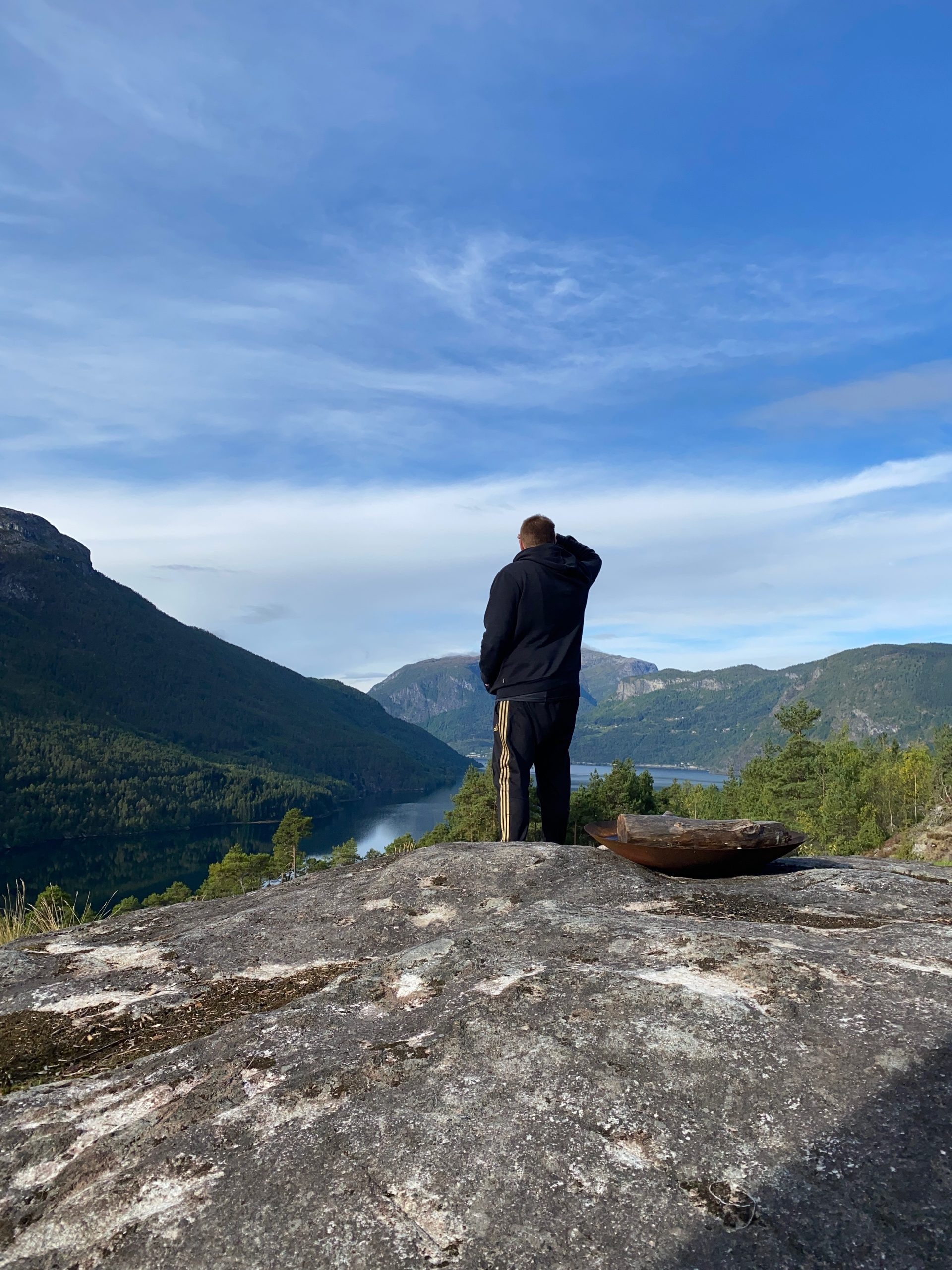 Timo van den Berg looking out over the fjord and mountains during a Sogndal Fjordpanorama Review in Norway