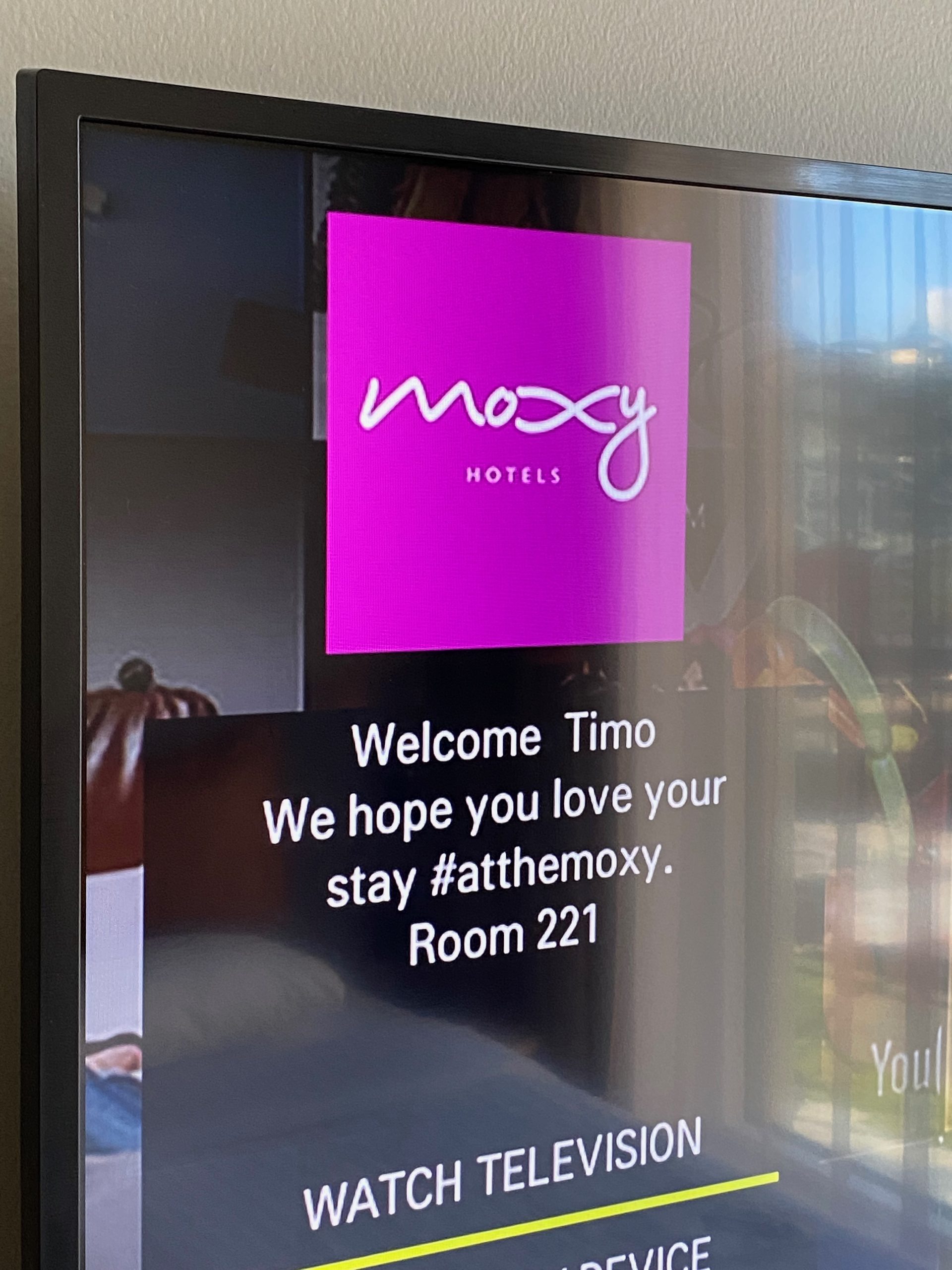 Moxy Hotel Bergen room TV showing a personal welcome message for Timo in room 221