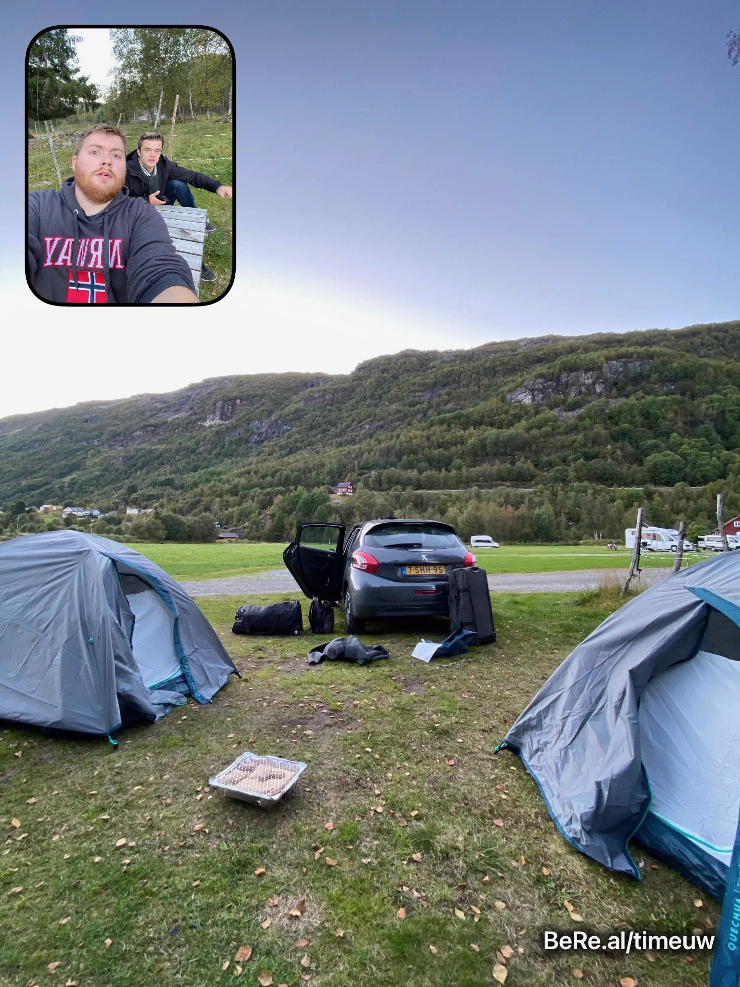 Timo van den Berg and Peter Smit camping at Seim Camping Røldal with two tents, a Peugeot 208, and mountain views in Norway.
