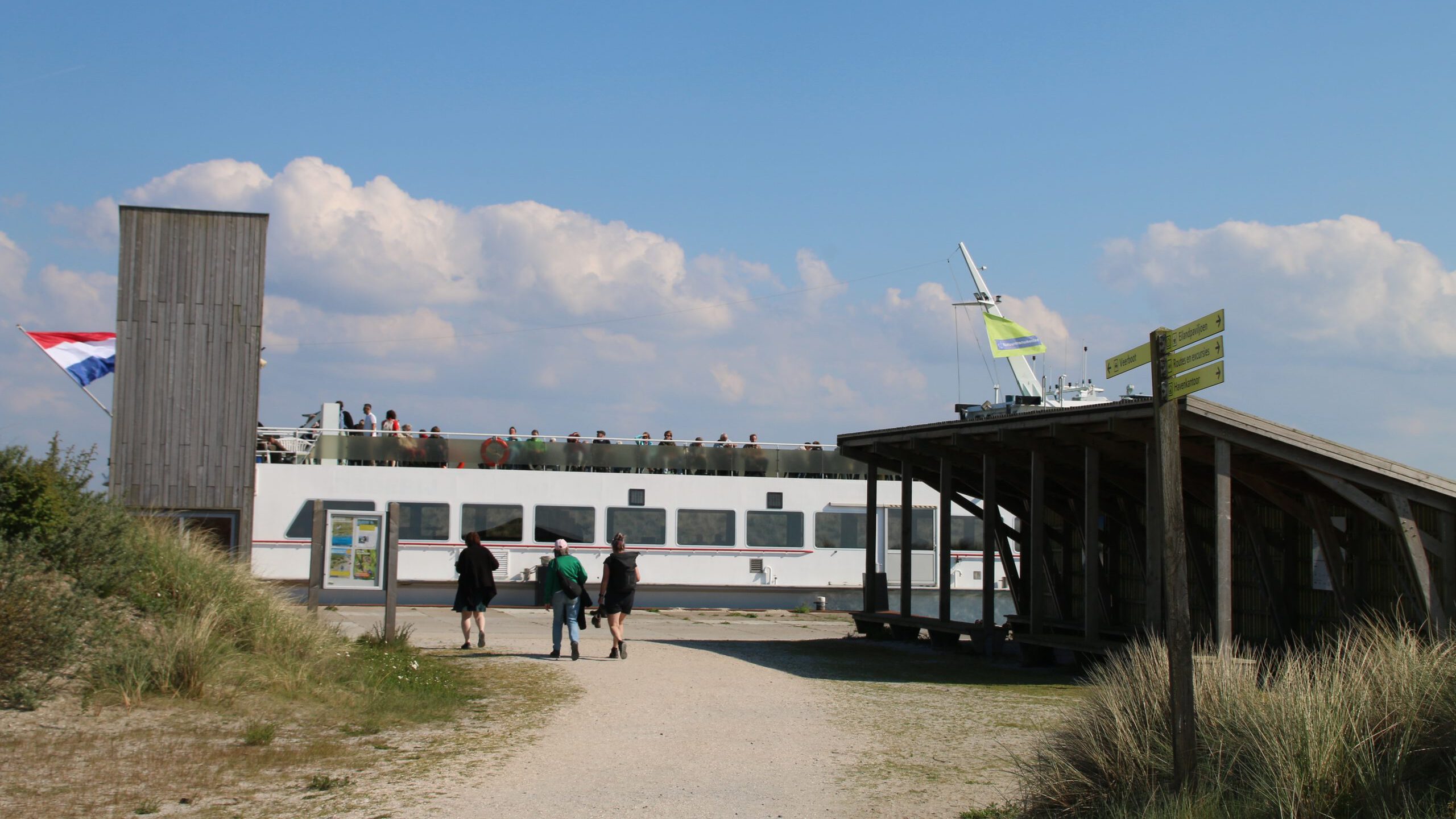 Marker Wadden island visit ferry departure point near the harbor, wooden bird hide and walking route signs